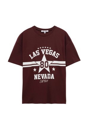 Burgundowa bawełniana koszulka z białym nadrukiem graficznym "LAS VEGAS" i "NEVADA" oraz gwiazdką i rokiem założenia, krótki rękaw, luźny krój.