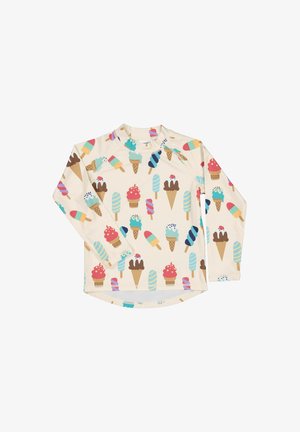Chemise crème à manches longues avec un motif coloré de cornets de glace et de sucettes glacées réparti uniformément sur le tissu.