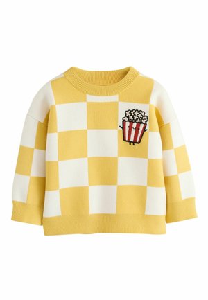 Yellow and white checkered long-sleeve sweater with a popcorn bucket patch on the left chest, ribbed collar, cuffs, and hem.