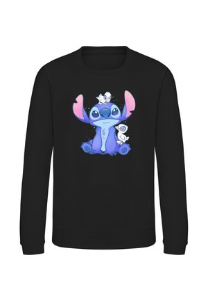 Sort langærmet skjorte med et farverigt tegneserie-design af en blå skabning med store ører og to små hvide fugle, der sidder på og ved siden af den.