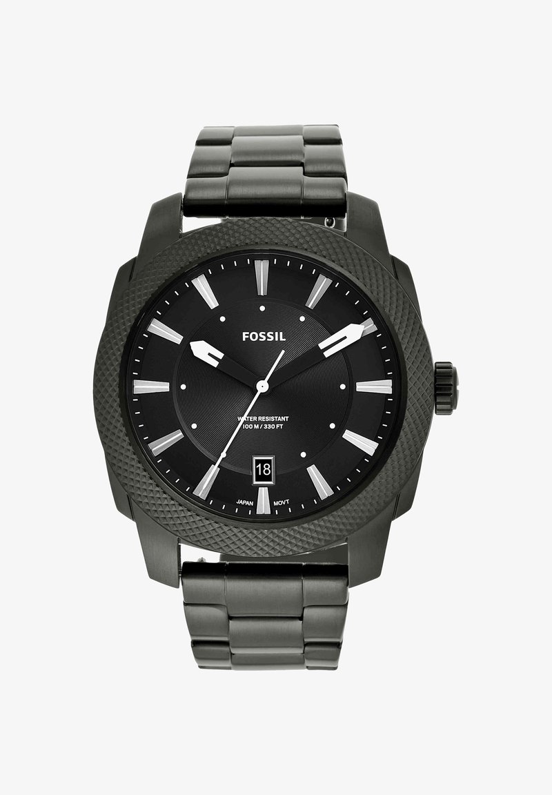 Montre-bracelet noire Fossil avec lunette ronde texturée, index argentés, affichage de la date à 6 heures et bracelet en métal lié affichant l'heure 9:10:36.