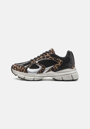 Leopard print sneaker featuring mesh and suede materials, silver accents, black details, thick sole, and a lace-up design.