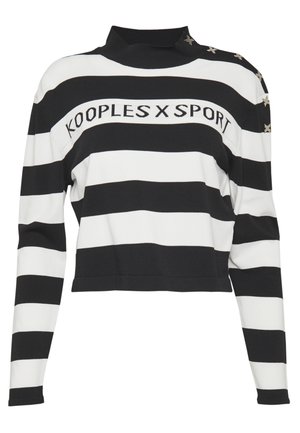 Musta-valkoraidallinen pitkähihainen crop-top, jossa korkea kaulus ja "KOOPLES X SPORT" -teksti rinnassa, tähtikoristukset hartioissa.