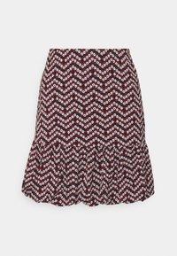 Jupe imprimée de fleurs rouges et blanches sur fond noir, avec un ourlet évasé et un motif en zigzag. Fabriquée en tissu à texture douce.