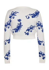 Pulover alb scurt cu modele florale albastre, mâneci lungi și guler și tiv cu striații. Textură moale, potrivit pentru ținute casual.