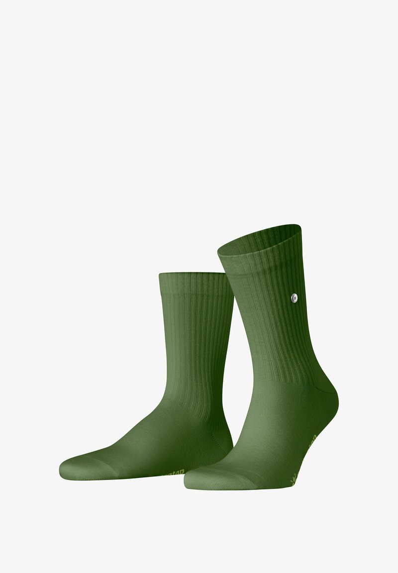 Grüne gerippte Socken mit glatter Textur und verstärktem Zehenbereich. Merkmale ein kleines Logodetail an einer Seite. Entwickelt für einen bequemen Sitz.