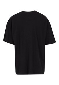 T-shirt noir à coupe ample en tissu côtelé. Doté de manches courtes et d'un col rond. Design simple, sans motifs ni accents supplémentaires.