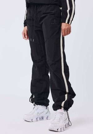 BAS DE JOGGING À BANDES EN SPORTLY - Pantalones - noir