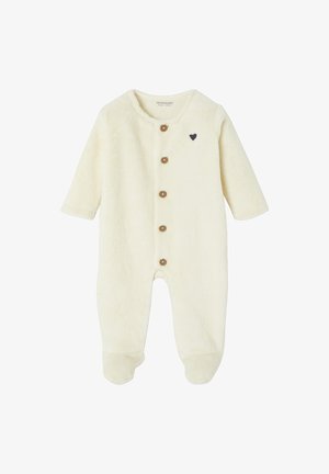 Cremfarbener, flauschiger Overall mit langen Ärmeln, rundem Halsausschnitt und Holzknopfverschlüssen; verfügt über ein kleines schwarzes Herzakzent.
