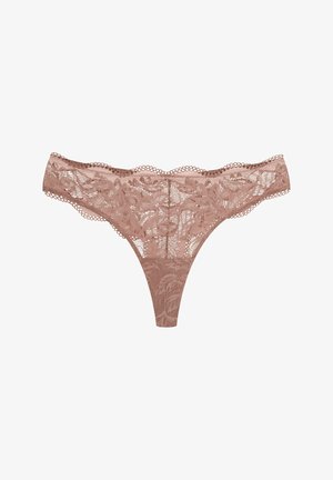 Lace thong in light brown, featuring floral pattern, scalloped edges, and a sheer texture. Minimal coverage with a V-shaped back.