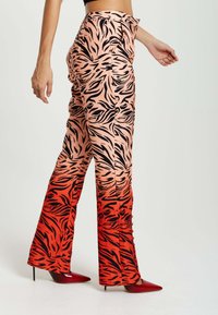 Liquorish WITH SLIT DETAIL - Trousers - red