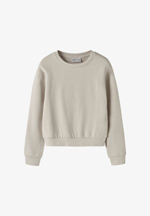 Beige kort sweatshirt med rund hals, långa ärmar och ribbade muddar. Mjuk textur med enfärgat mönster, utan mönster eller detaljer.