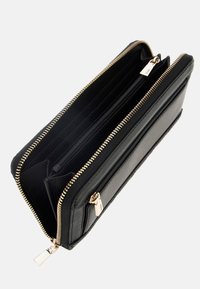 Black leather wallet featuring gold zipper, multiple card slots, and a zippered compartment. Smooth texture with a clear, structured design.