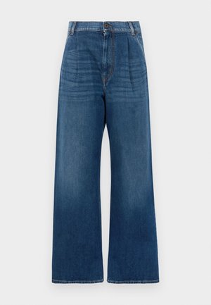 Høyt livde vide jeans i blå denim. Har frontknapp, folder og en subtil falming fra mørk til lys blå i kanten.
