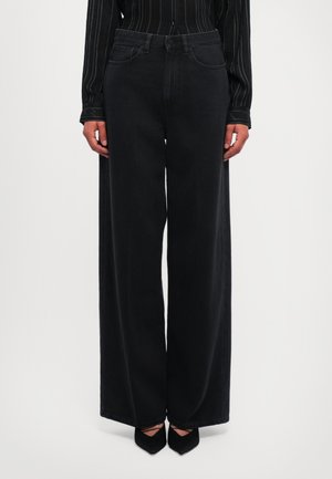 High-waisted black wide-leg jeans in a sturdy fabric, featuring two front pockets and a classic five-pocket design.