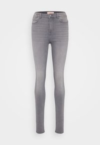 Korkeavyötäröiset skinny-farkut vaaleassa harmaassa denimi-kankaassa, jotka ovat sileäpintaiset, viidellä taskulla ja hienovaraisilla ompeluyksityiskohdilla.