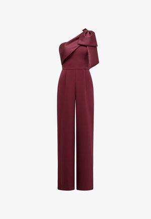 Jumpsuit bordeaux cu un umăr, cu picioare largi și un detaliu mare sub formă de fundă pe umăr.