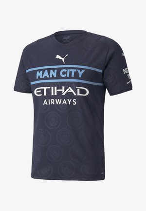 Camiseta de fútbol azul oscuro del Manchester City con rayas azul claro, patrón de logos del club, logotipo de Puma y texto patrocinador de Etihad Airways.