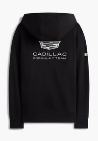 Svart hettegenser med Cadillac-logo og teksten "Cadillac Formula 1 Team" på baksiden, med hette og ribbestrikkede mansjetter.