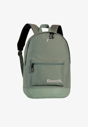 Green fabric backpack with a smooth texture, featuring a front zipper pocket, logo print, and padded adjustable straps.