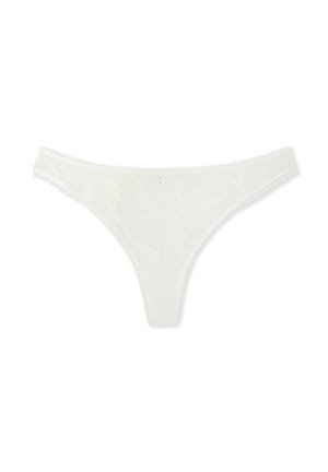 White lace thong featuring intricate floral patterns, thin elastic bands, and scalloped edges. Soft texture with a delicate finish.