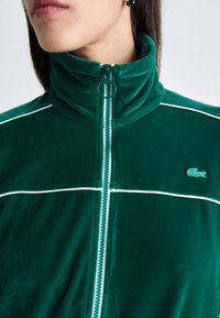 Lacoste Sweater met rits - fluorine foncé/white