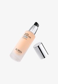 Foundation bottle with a frosted finish, light peach color, silver pump cap, labeled "KIKO MILANO INSTA MOISTURE GLOW." Cap is slightly off.