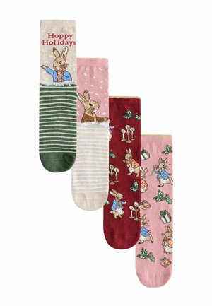 Set aus vier Socken mit verschiedenen Designs: "Hoppy Holidays"-Text, Hasenillustrationen, Streifen, Punkte und Feiertagsmuster in Grün, Pink, Rot und Beige.