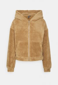 Giacca felpata con cappuccio di colore beige, dotata di zip frontale, due tasche laterali e polsini a costine. Tessuto morbido e design semplice.