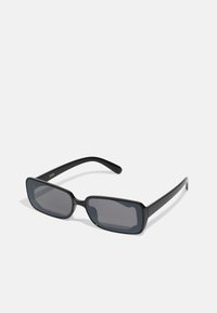 Black rectangular sunglasses with dark lenses, featuring a sleek frame design and thin temples. Smooth surface with reflective accents.