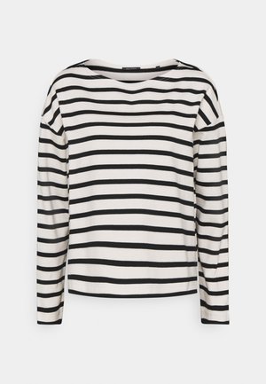 Chemise blanche à manches longues avec des rayures horizontales noires et un large col rond, présentée à plat sur un fond clair.