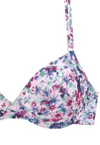 Bh met bloemenpatroon en gevoerde cups, voorzien van gekleurde bloemen op een lichtroze achtergrond en verstelbare bandjes met zilveren hardware.