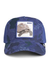 Gorra decorduroy en camuflaje azul con parche bordado de tortuga etiquetado "BÁSICO" centrado en el panel frontal.