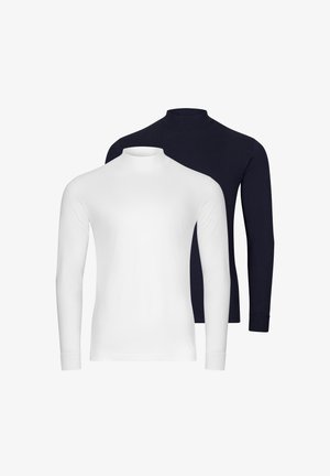 Deux chemises à manches longues avec col mock, une blanche au premier plan et une noire derrière, présentées sur un fond blanc.