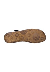Rubber shoe sole in brown with detailed floral patterns. Features a textured grip, slightly raised edges, and an overall flat shape.