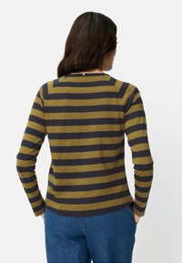 Langärmeliges Hemd mit olivgrünen und marineblauen Streifen, mit rundem Ausschnitt und lockerem Schnitt. Weicher Baumwollstoff, lässiges Design.