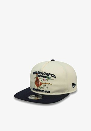 Creme- und marineblaue Kappe mit besticktem Fasan und Text "New Era Cap Co. Buffalo Established 1920", mit New Era-Logo an der Seite.