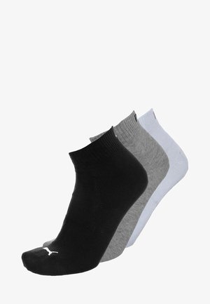 Three ankle-length socks in black, grey, and white, arranged overlapping on a white background.