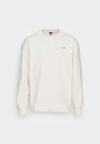 Vit crewneck sweatshirt tillverkad av mjukt tyg. Har ribbade muddar och nederkant, med en liten broderad logotyp på bröstet.