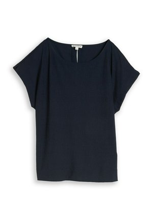 Blouse bleu marine à manches courtes avec un large décolleté et une coupe ample, fabriquée en tissu léger, posée à plat sur un fond blanc.