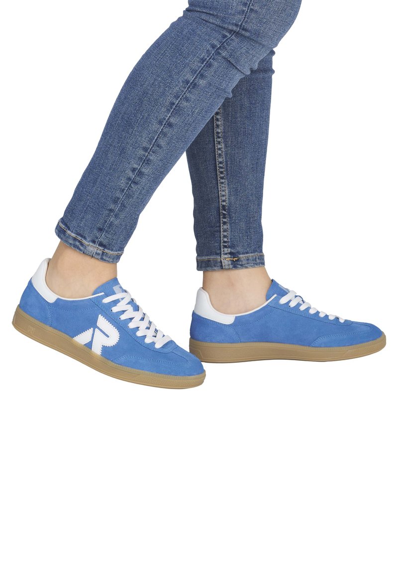 Blue suede sneakers with white accents, lace-up design, and a gum rubber sole. Features a prominent logo on the side.