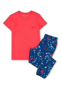 Coral cotton t-shirt with pocket and blue floral-patterned pajama pants, featuring red and white flowers on a navy background.