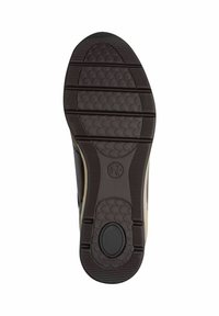 Shoe sole with a textured, rubberized surface; features deep grooves and circular patterns for traction; primarily dark brown color.