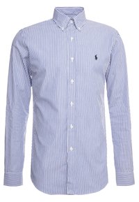 Niebiesko-biała, w paski, bawełniana koszula z długimi rękawami, klasycznym kołnierzykiem i małym logo na lewej piersi.