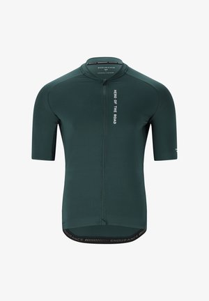 Lyhythihainen pyöräilypaita tummanvihreästä kankaasta. Varustettu edessä olevalla vetoketjulla ja "Hero of the Road" -tekstillä rinnassa. Saumaton muotoilu istuvalla siluetilla.