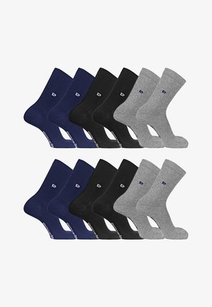 Deux ensembles de six chaussettes unies à hauteur de cheville, en bleu marine, noir et gris, disposés côte à côte sur un fond blanc.