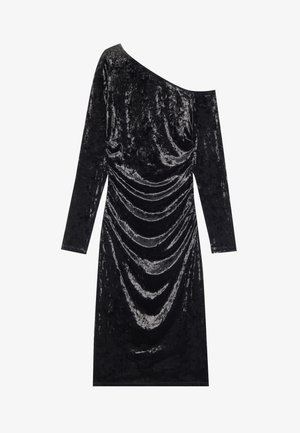 Black velvet dress with long sleeves and an asymmetric neckline. Features draped detailing along the front. Smooth texture and sleek design.