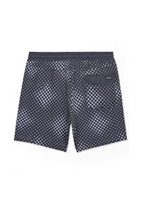 Short de bain noir pour homme avec motif géométrique blanc composé de points et de carrés, taille élastique et poche arrière avec étiquette de la marque.