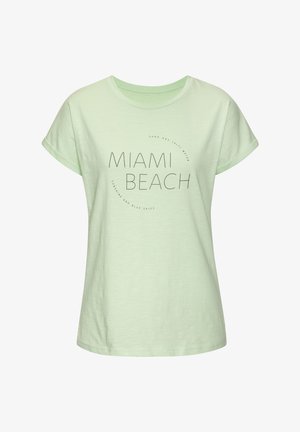 Light green, short-sleeve t-shirt featuring "MIAMI BEACH" text and round graphic design, made of soft fabric with a smooth texture.