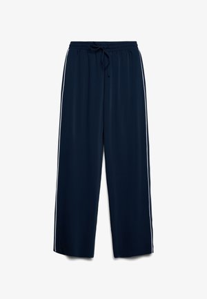 Pantalon large bleu marine avec taille élastique et cordon de serrage, arborant des rayures blanches sur les côtés.